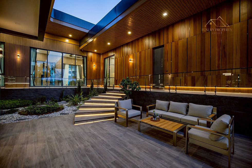 A modern luxury property in Pattaya featuring biophilic design and floor-to-ceiling heat-reflective glass and with modern minimalist Zen garden.