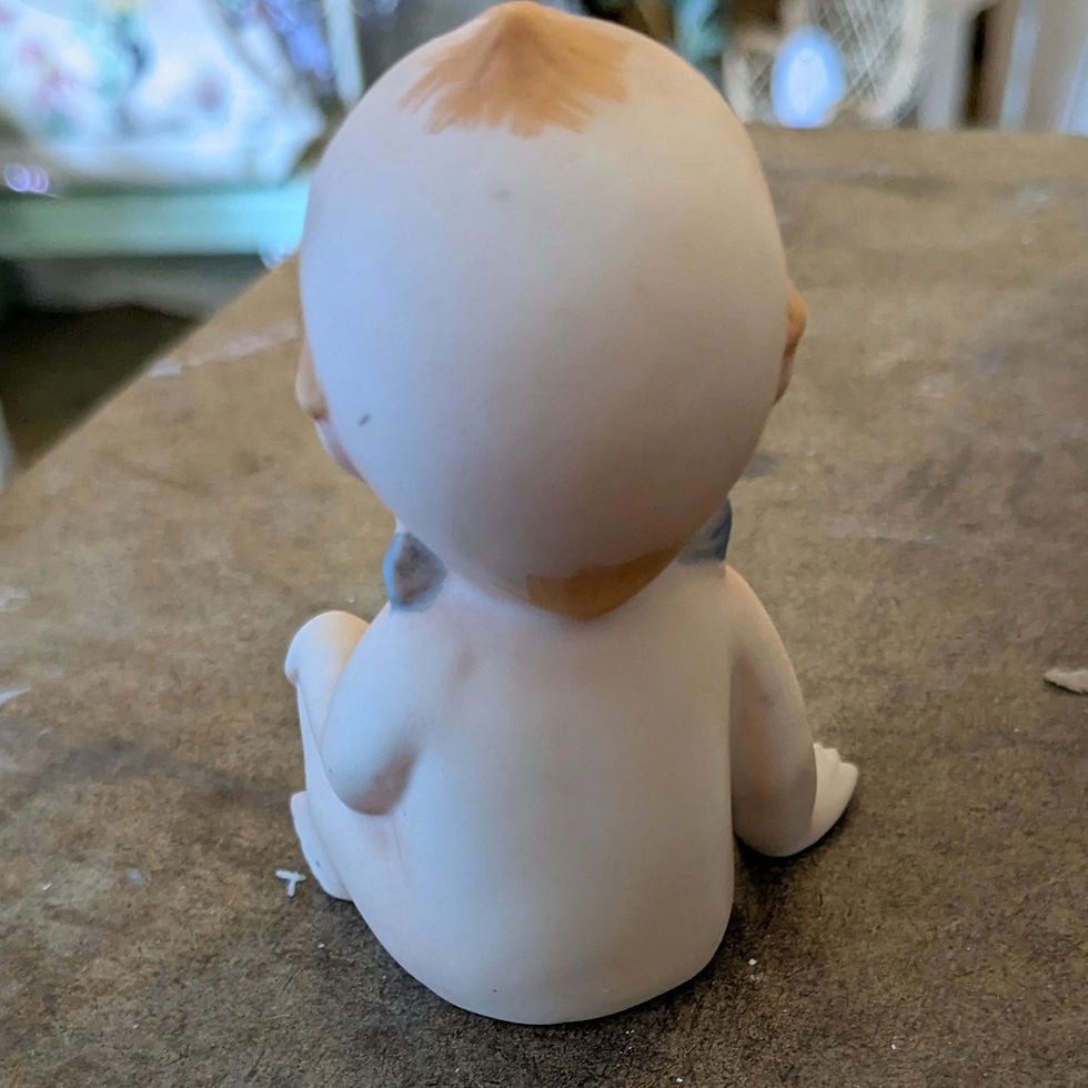Thumbnail: Vintage Lefton Kewpie Baby Leg Crossed w/ Hand on Knee, Blue Wings, Yellow Tuft