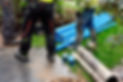 Workers with blue pipes and tools