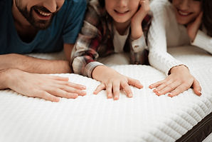 hands on a mattress