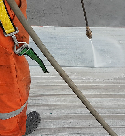Prepping a steel sloped roof for a polyurea liner and coating.PNG