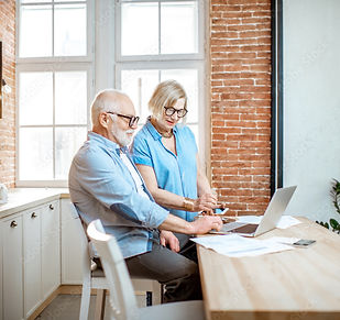 old couple working with laptop
