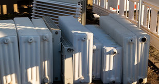 A collection of old white heating radiators