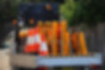 Road construction companies vehicle. The ute loaded with traffic control signage and orang