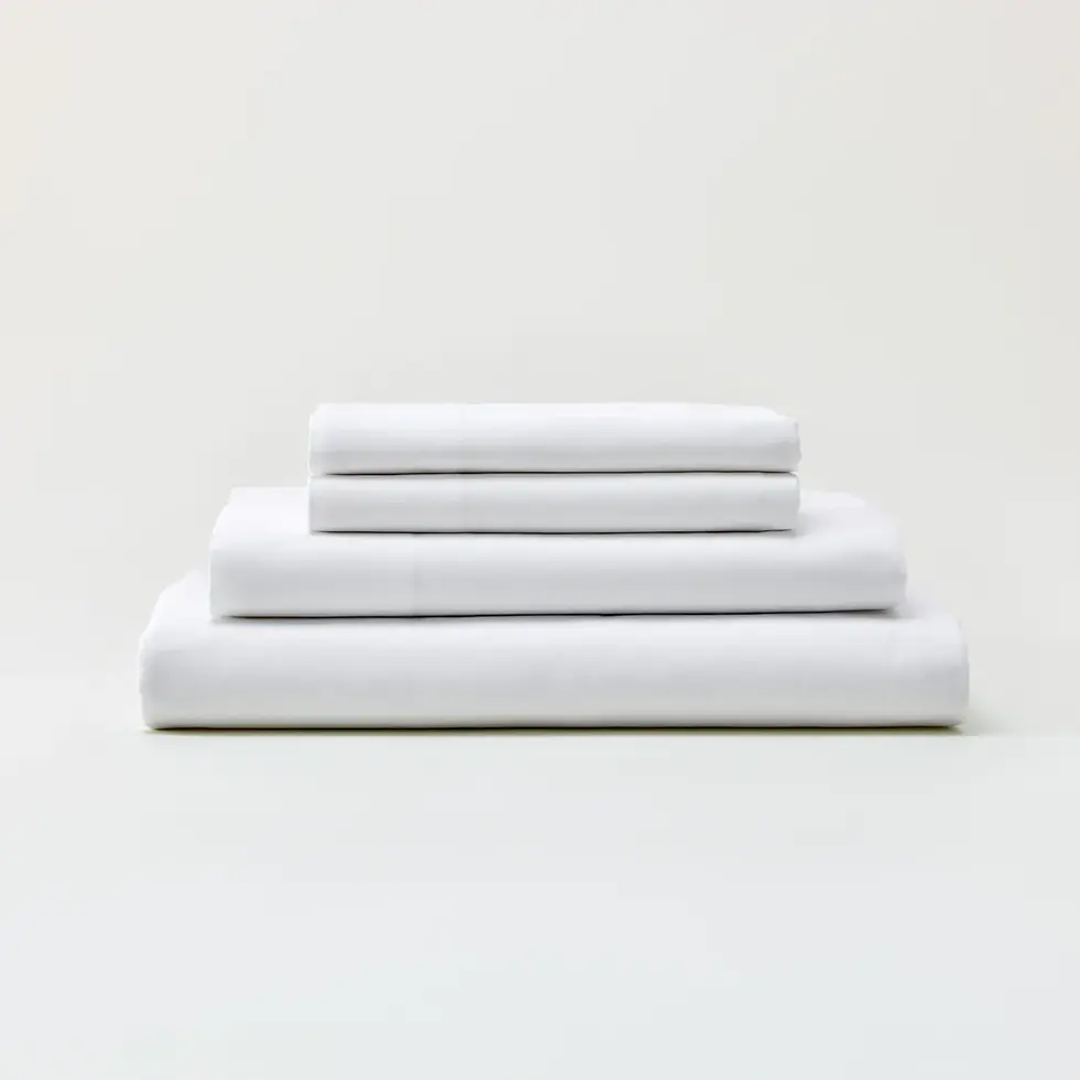 Set of folded white sheets (2 pillow cases, and 2 sheets)