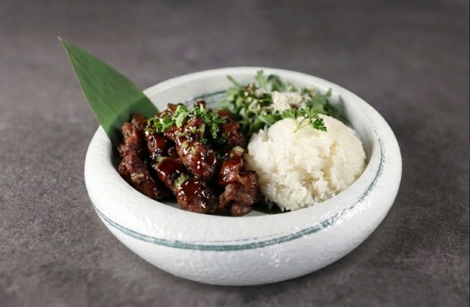 Sweet glazed meat, green onions, fluffy white rice, fresh salad.