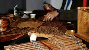 Hand rolling cigars, rich tobacco aroma