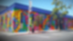 School of Arts & Enterprise main HS Campus building painted in bold colorful graphics mural on all outside walls