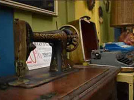 Antique sewing machine and typewriter on display