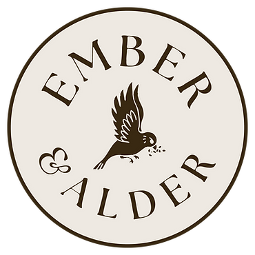 Ember & Alder circular logo with bird in flight, black on tan