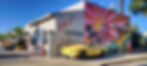665 Karmann Lofts building with mural and yellow vintage car