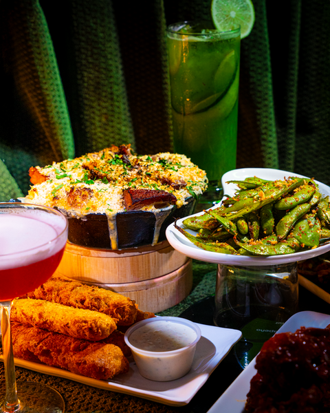 Plated appetizers and cocktails on display, V Lounge restaurant setting