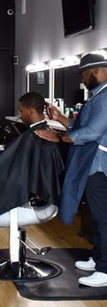 Fadeaway Barbershop: Man getting a haircut