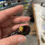 Thumbnail: Orchid petals with Green Wood Duck Feather Pin