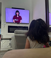 A child watching Ms Raven on a TV