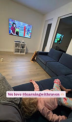A child watching Ms Raven on a TV