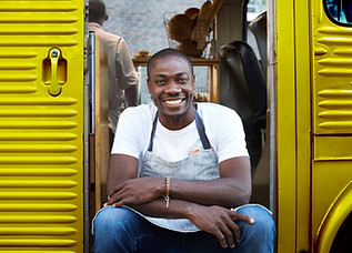 Man on Doorway of Food Truck