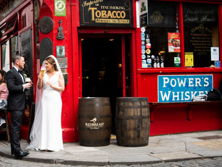 A newly married couple enjoying a pint outside of a pub in Temple Bar