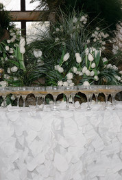 White tulip wedding installation designed by Fauna Flower Folk at Kinmount House with champagne