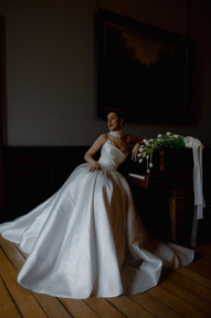 Contemporary bride in couture wedding gown with soft natural styling