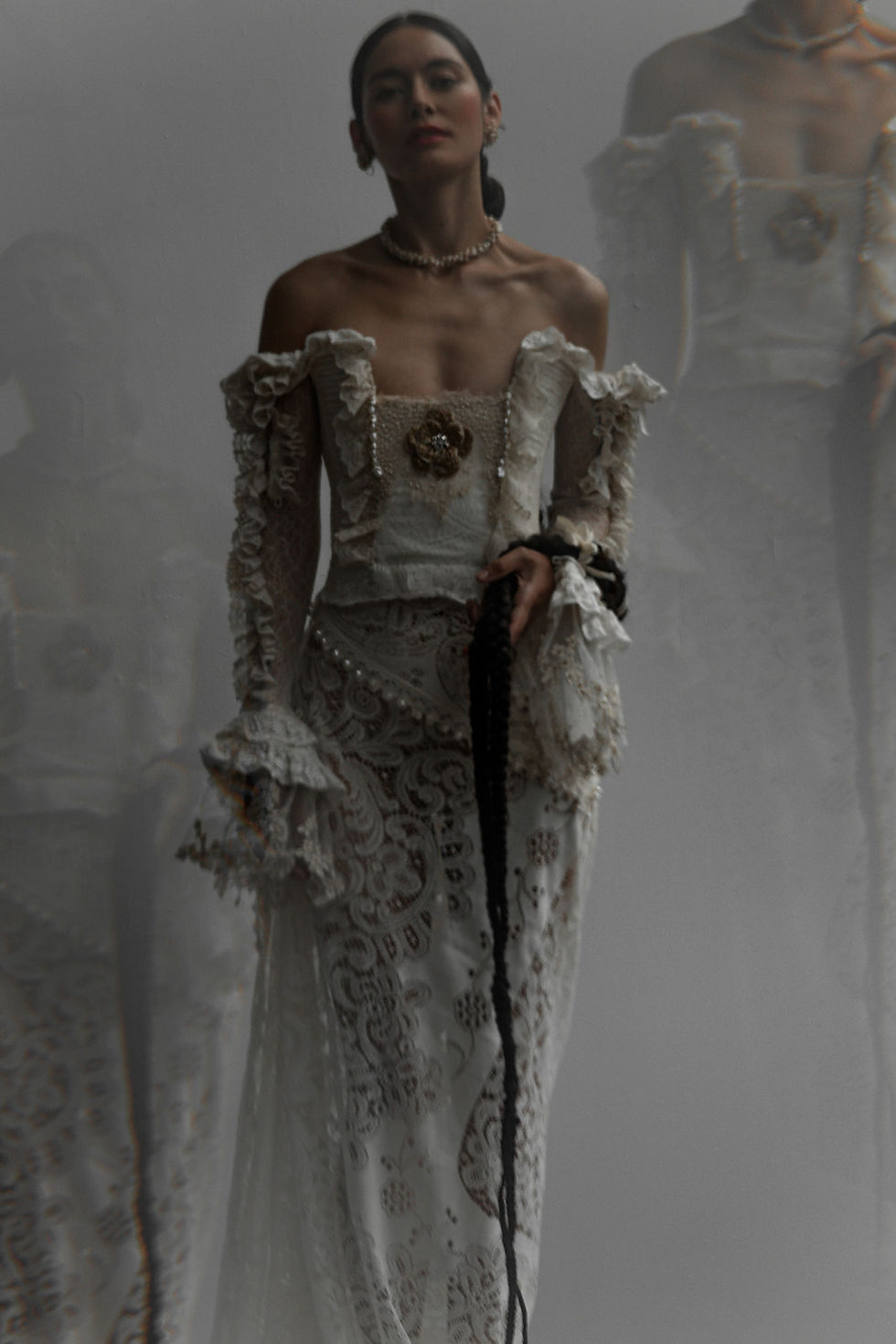 Julita London Dear gown with sculptural bodice and pearl embellishments in artful bridal editorial.