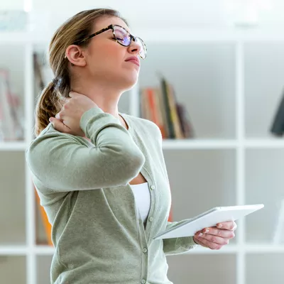 Woman experiencing neck pain