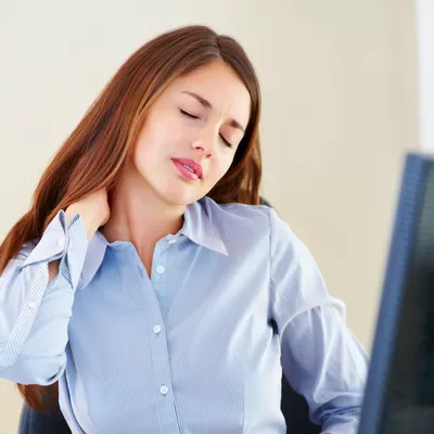 Woman suffering from neck pain