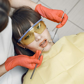 woman-dental-chair-girl-is-examined-by-dentist-beauty-treats-her-teeth_edited.jpg