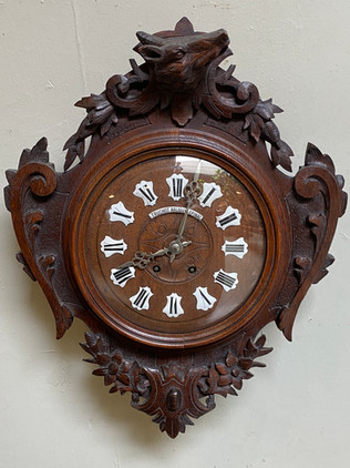 Antique Black Forest carved oak wall clock with enamel numerals & decorative floral details