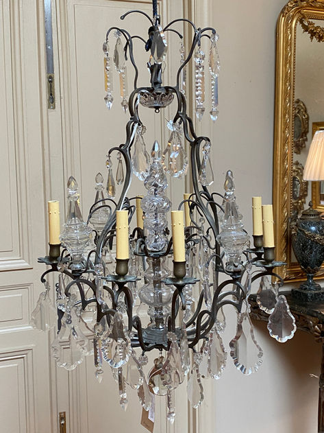 Antique French large bronze cage frame 8 light chandelier with crystal hollow spears, drops, column, and solid ball