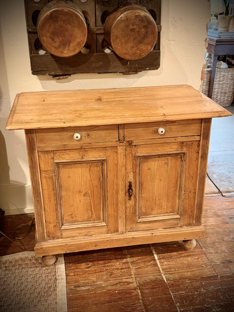 Antique pine sideboard cabinet with two drawers over double doors