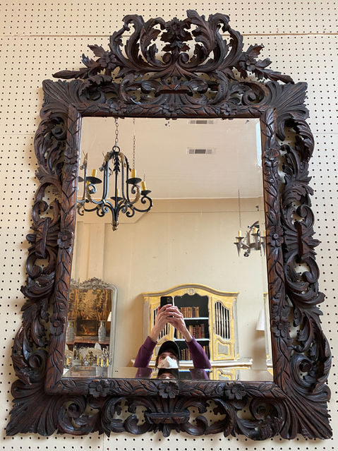 Antique French mid 19th century Black Forest hand carved walnut cushion mirror with beveled glass & cartouche