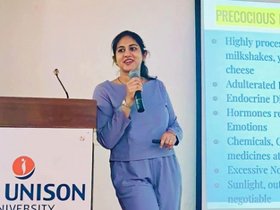 Vaidya Vijeta Shukla delivering a women's health and breastfeeding awareness session.
