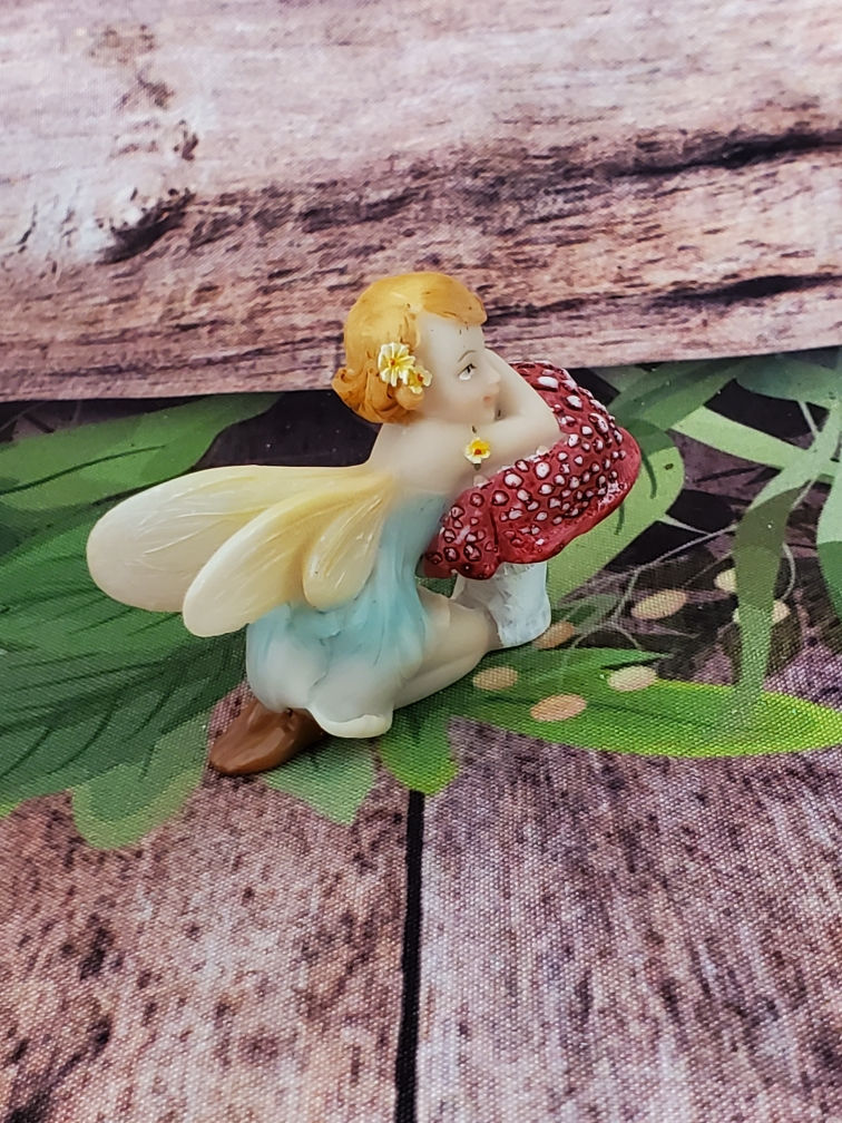 Fairy Kneeling on Mushroom