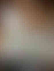 Great room with vaulted ceilings, floor-to-ceiling windows, and stone fireplace