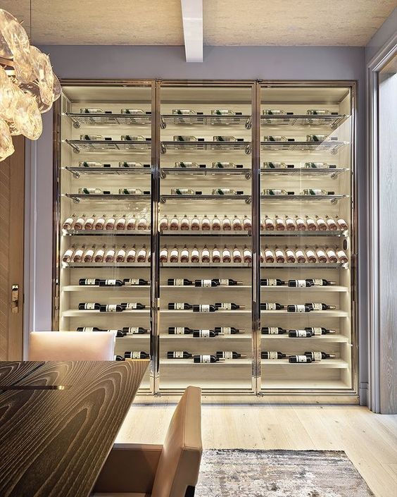Mirrored stainless steel wine wall encased in glass