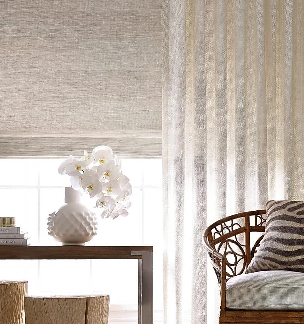 Neutral-hued luxury window coverings in a modern interior.