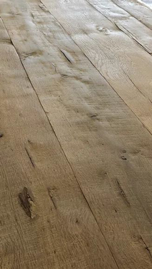 Warm, medium-toned hardwood flooring materials like this one are currently popular.
