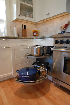Corner cabinet with pullout shelves in a luxury custom kitchen design