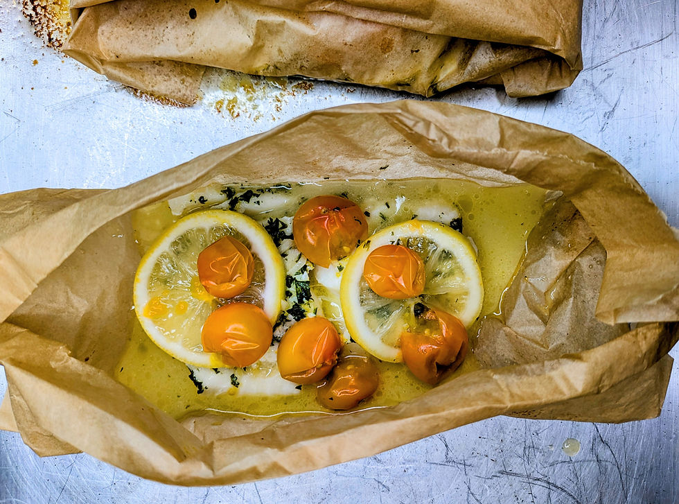 Butter, parsley, lemon, and cherry tomatoes comingle with tender haddock fillets
