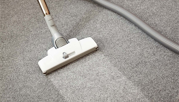 Vacuuming A Carpet