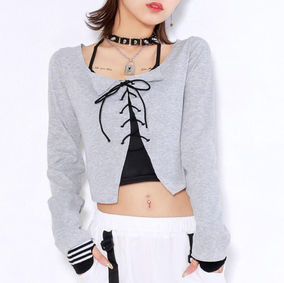 Girl wearing a gray and black lace-up long-sleeve top set