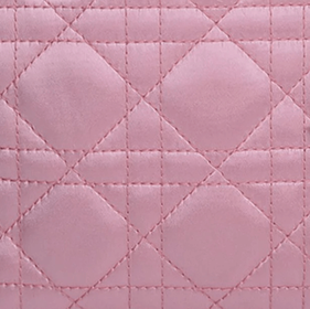 Close-up of a Dior Lady Dior bag showing the Satin material