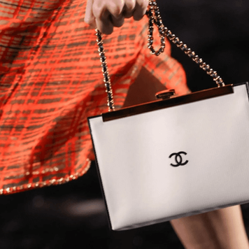 White Chanel bag on a fashion show