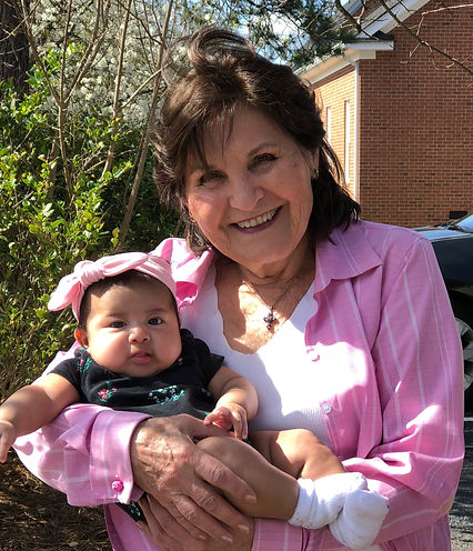 Eva holds a baby she saved from abortion
