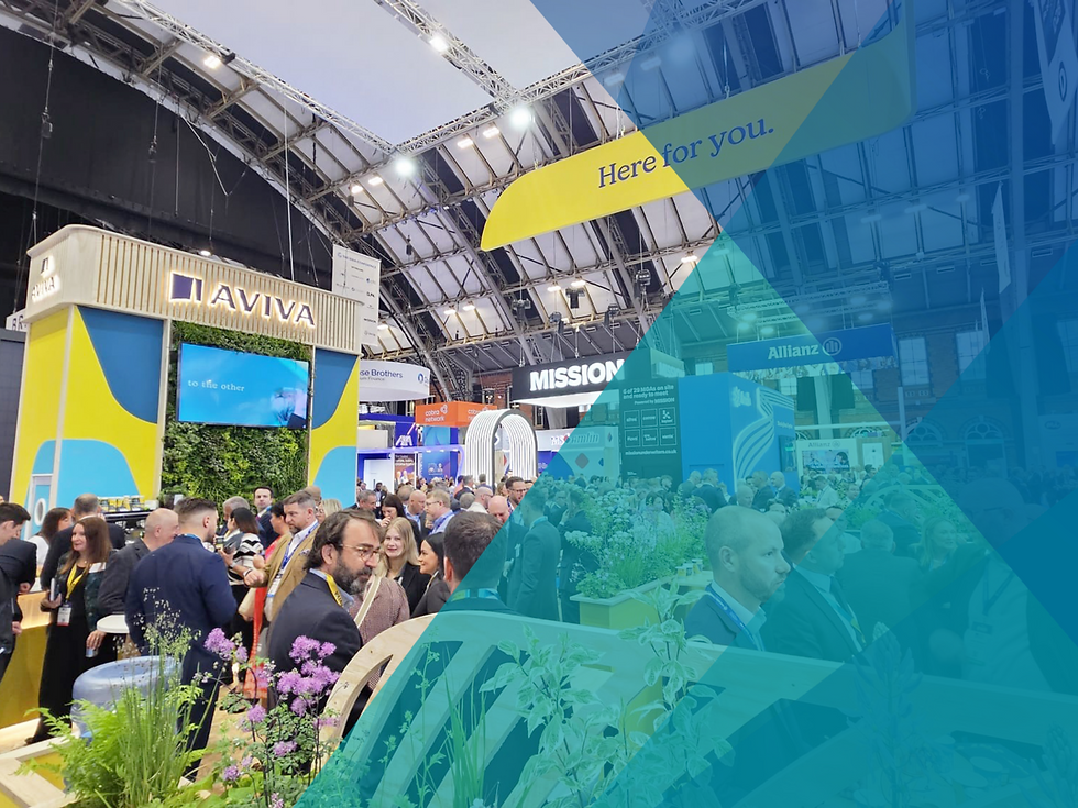 A busy exhibition stand, with 'Aviva' written at the top of it. There are lots of people in suits filling the stand and chatting.