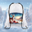 Thumbnail: White drawstring bag, majestic deer, snowy village, mountains, winter gifts.