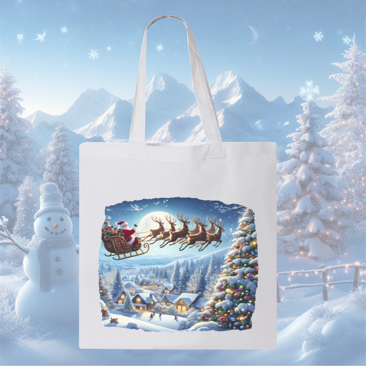 White canvas bag with Santa flying sleigh over snowy Christmas village.
