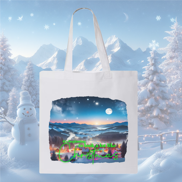 White Let it Snow Canvas Bag, winter village scene, snowy background.