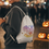 Thumbnail: Smiling person carries "No Tricks Just Treats" drawstring bag at a Halloween event.